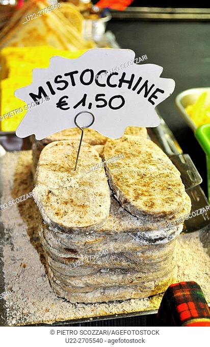 Bologna, Italy: mistocchine, traditional sweet made with chestnuts flour, sold at Fiera di Santa Lucia