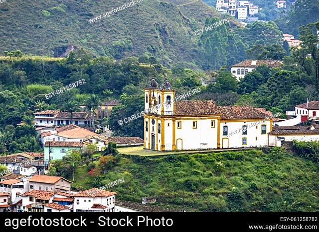 View from above of one of the several historic churches in baroque style in the city of Ouro Preto in Minas Gerais with houses and colonial style around it