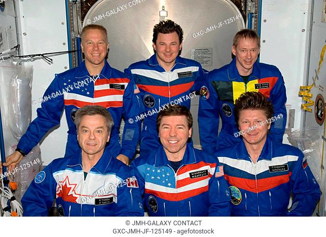 Expedition 20 crew members pose for an in-flight portrait in the Harmony node of the International Space Station. Pictured from the left (front row) are...