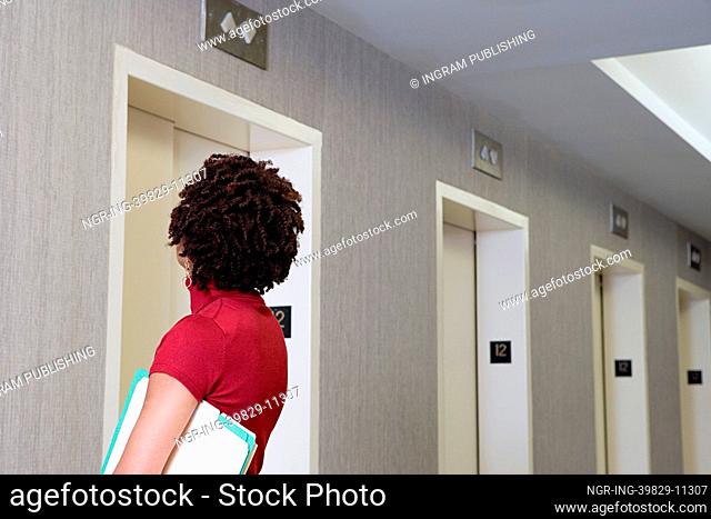 Woman waiting for elevator