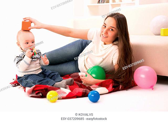 mother and son playing in room