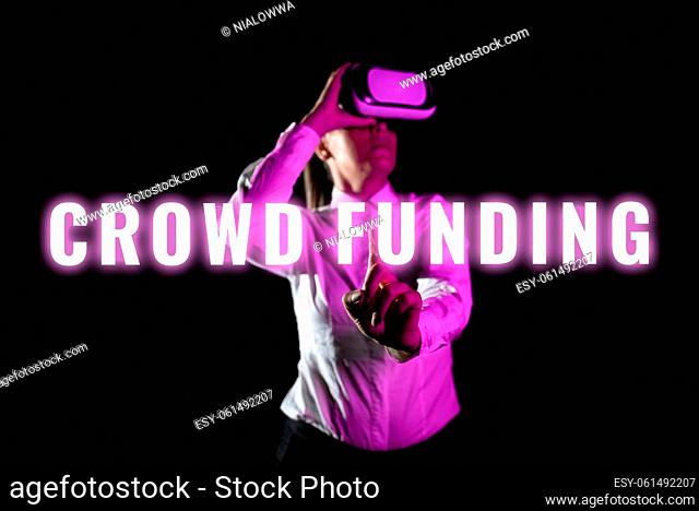 Text showing inspiration Crowd Funding, Business overview Fundraising Kickstarter Startup Pledge Platform Donations Woman Using Virtual Reality Simulator And...