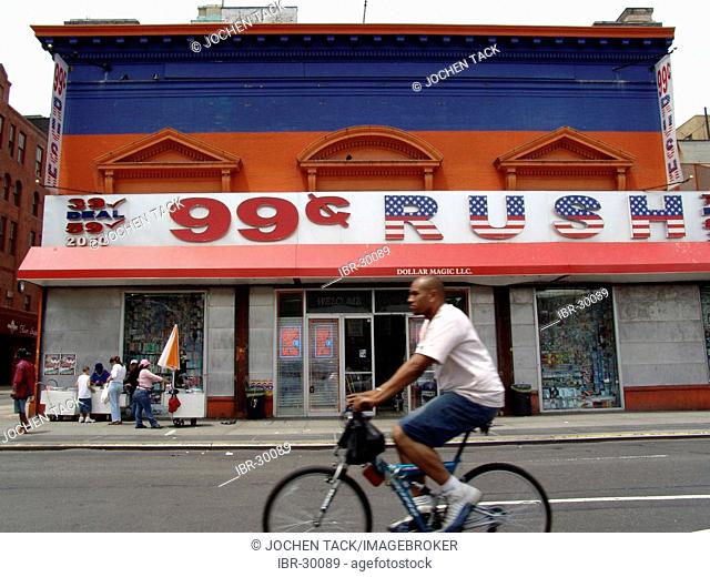 USA, United States of America, New York City: Harlem, 125th Street, shops with cheap goods, 99 cent bargains