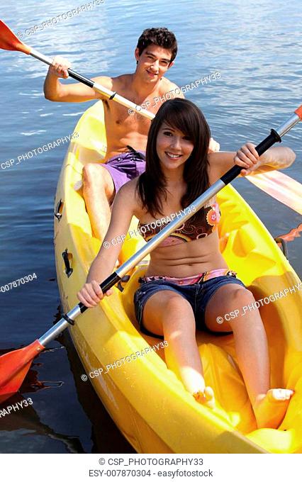 young couple canoeing