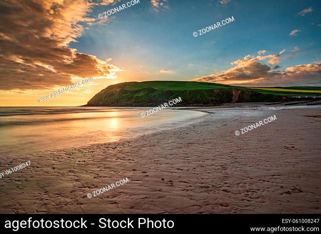 Sunset and dark clouds over the St Bees Heritage Coast near Whitehaven in Cumbria, England, UK