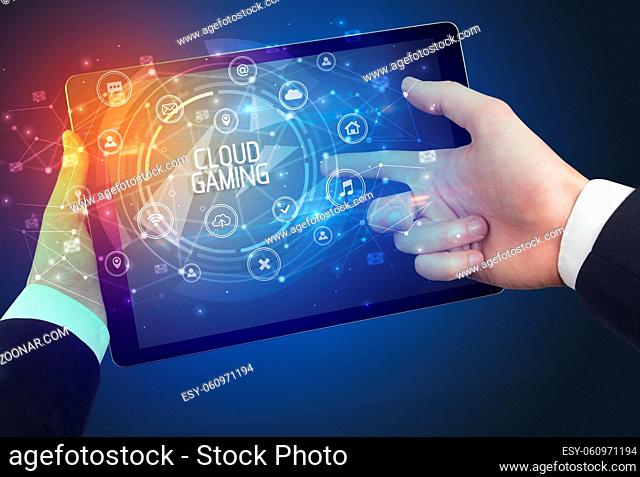 Close-up of a tablet with CLOUD GAMING inscription, innovative technology concept