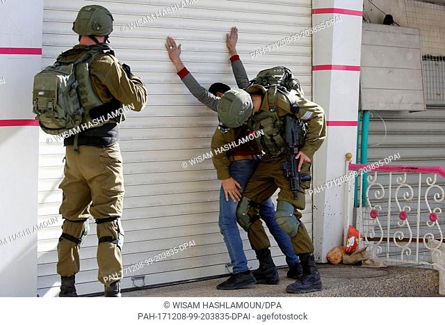 A Palestian man gets arrested during clashes with Israeli forces in Hebron, West Bank, 08 December 2017. Palestinian leaders called for a day of rage in...