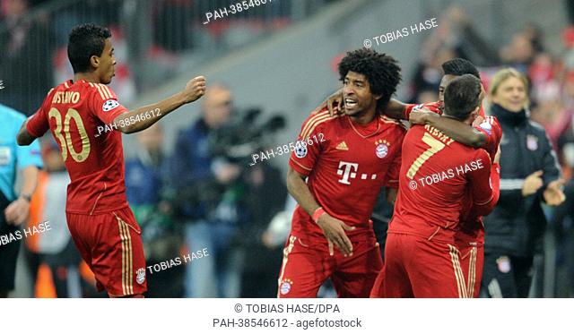 Munich's David Alaba (R) celebrates with his team mates Franck Ribery (2-R), Dante (3-R), Luiz Gustavo (L after scoring the opening goal (1-0) during the UEFA...