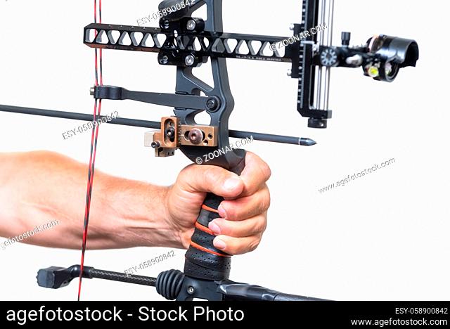 Archer close up, preparing the arrow for the shot, on white isolated background