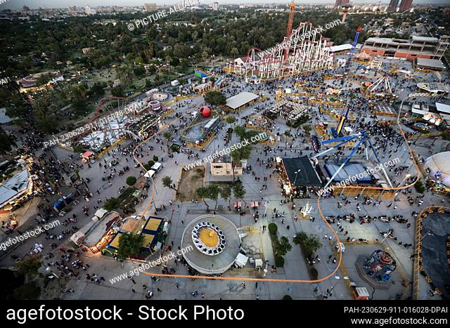 29 June 2023, Iraq, Baghdad: A general view of Al-Zawraa amusement park, during the celebrations of Eid al-Adha holiday in Baghdad