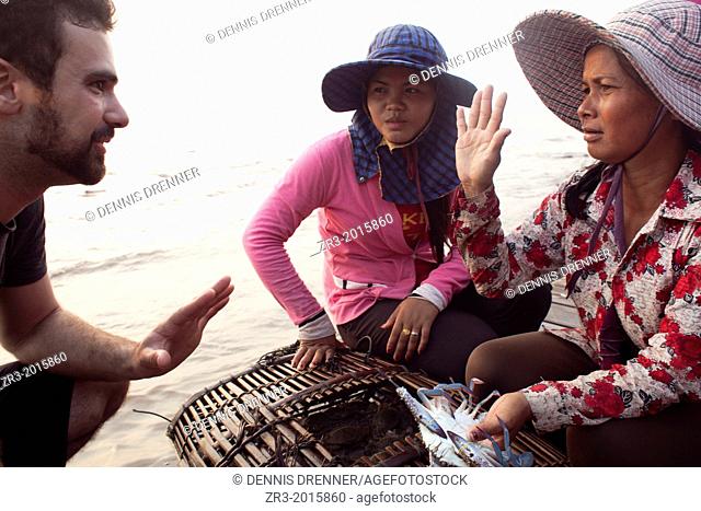 Women sell crabs at the crab market in the resort town of Kep, Cambodia