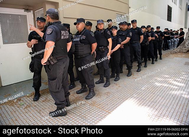 19 November 2023, Argentina, Buenos Aires: Police officers stand at the Almagro campus of the National Technological University
