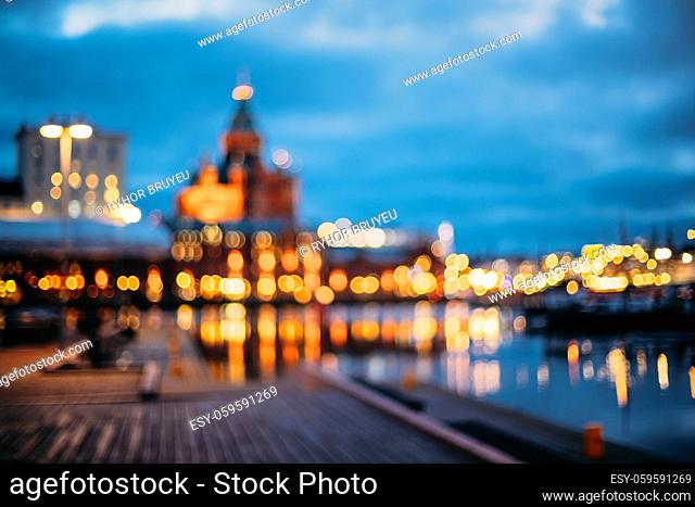 Helsinki, Finland. Abstract Blurred Bokeh Architectural Urban Background Of Uspenski Cathedral And City Embankment. Real Defocused Colorful Backdrop Lights Of...