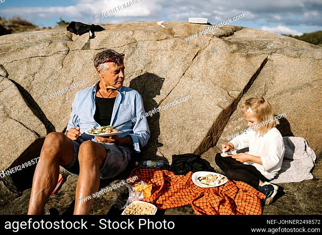 Father and daughter having picnic