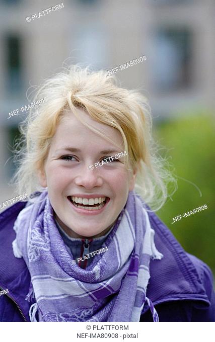 Portrait of smiling teenage girl in park