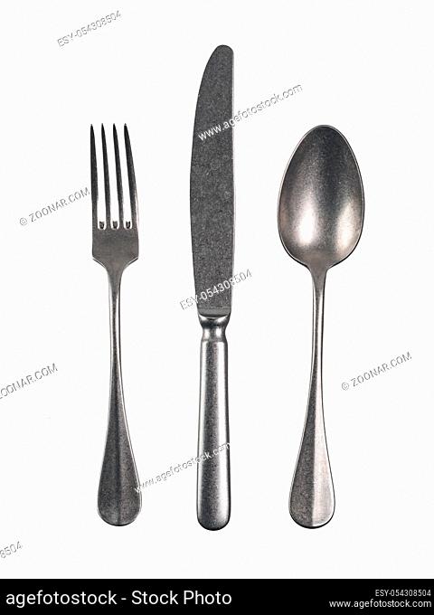 Modern cutlery with antique effect. Cutlery set with Fork, Knife and Spoon Isolated on white with clipping path