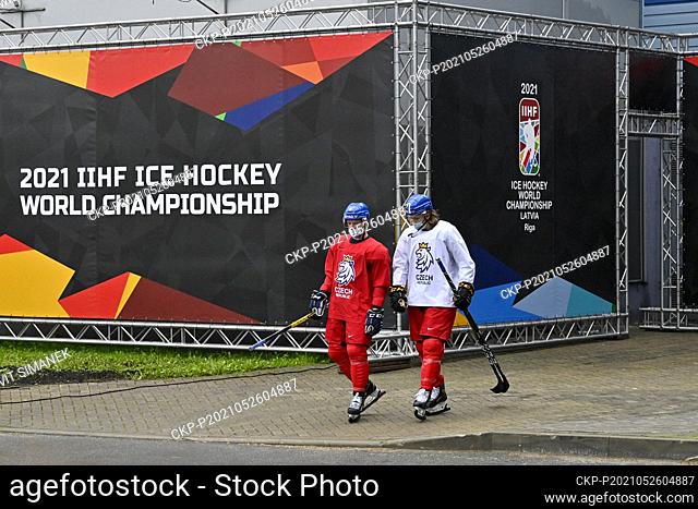 David Sklenicka, left, and Libor Sulak of Czech Republic on the way to a bus that will take them to the training hall during the 2021 IIHF Ice Hockey World...