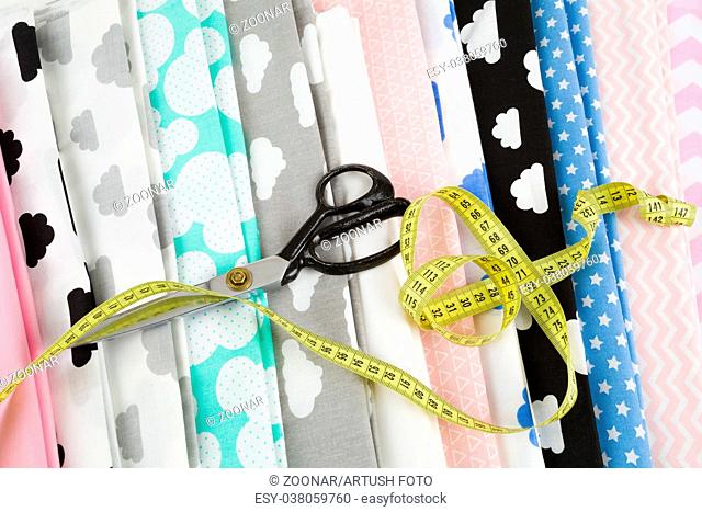 cotton fabric material, tailor measurement tape and scissors
