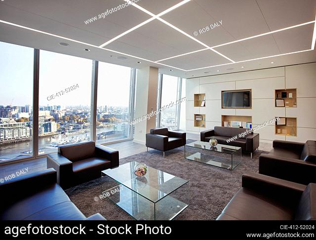 Modern highrise business office lobby overlooking city