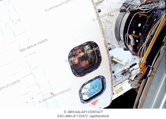 From the aft flight deck of the Space Shuttle Atlantis, astronauts Stephen N. Frick, STS-110 pilot, Rex J. Walheim and Steven L
