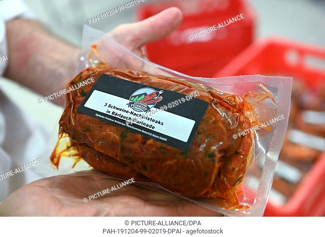 03 December 2019, Hessen, Usseln: In the ""Upländer Feinkost Waldecker Fleischwaren Heinrich Saure GmbH"" a packed neck steak is shown