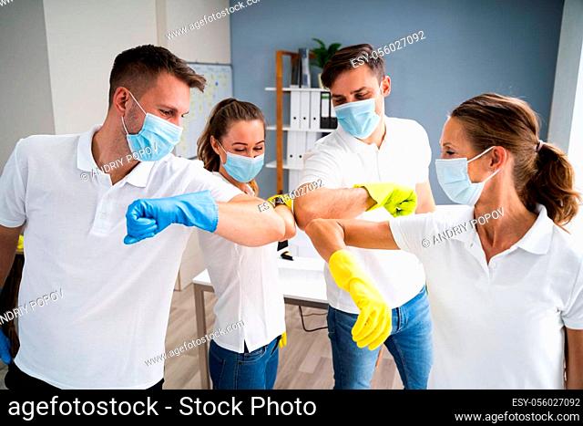 Professional Office Cleaning Janitor Team Spirit And Huddle With Face Masks