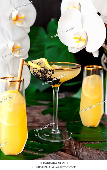 Elegant, exotic cocktail with lush fresh orchids
