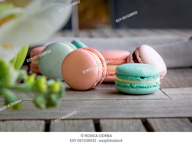 Homemade Fresh Colorful French macarons cake, on natural concrete wooden background. Food concept with copy space. Horizontal image
