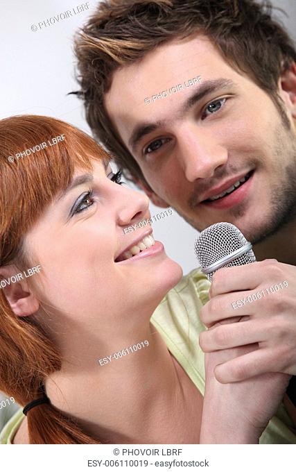 Couple singing karaoke