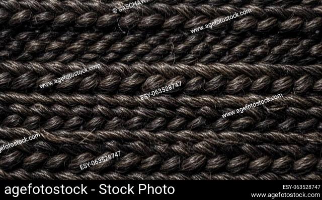 This photograph captures the intricate texture of jute textile material in black color with a wicker pattern. Shot from a top-down ultra-wide-angle view