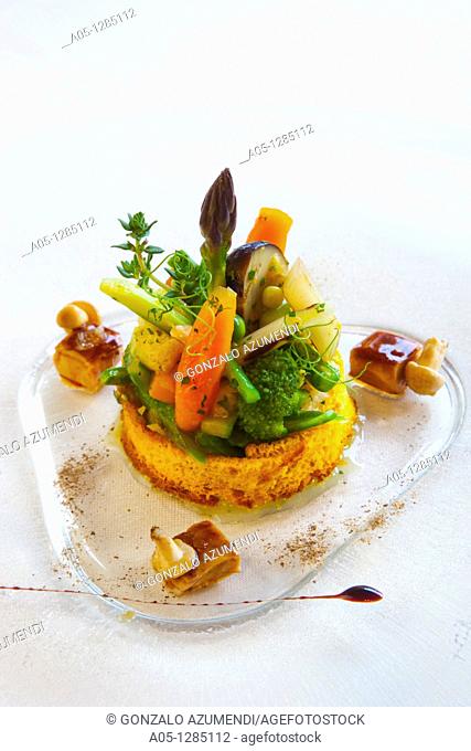 Young vegetables sauteed with foie in carrot bread Boroa Restaurant Amorebieta-Etxano. Biscay, Basque Country, Spain