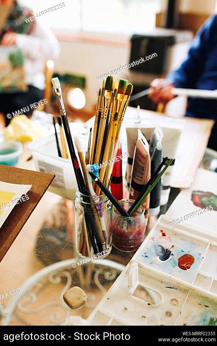 Paintbrushes on table at home