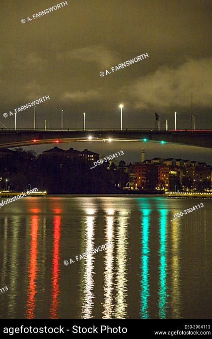 Stockholm, Sweden A view of the Essingeleden highway and bridge and nautical shipping lights reflecting in the water