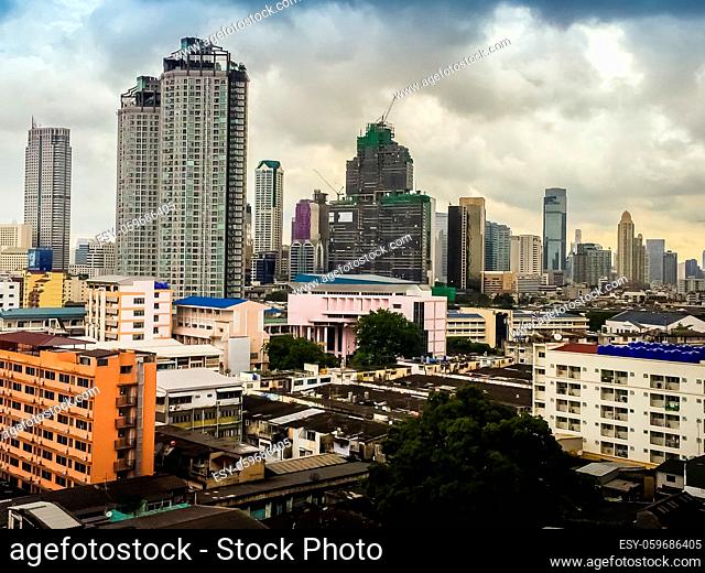 Skyline of big city full of skyscrapers in the business district of Bangkok, view from condominium in Petchburi Road