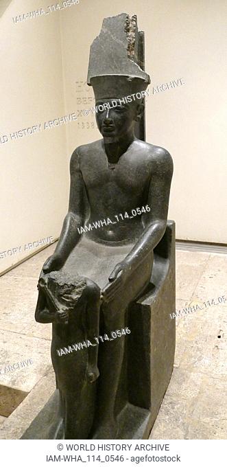 statue of Amun with Horemheb before him. 18th Dynasty, Egyptian. Amun was one of the eight ancient Egyptian gods who formed the Ogdoad of Hermopolis