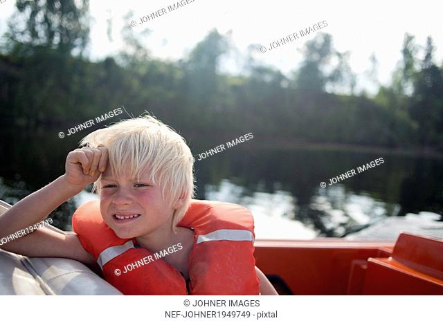 Boy on boat, Siljan, Dalarna, Sweden
