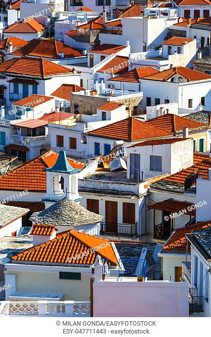 White houses with red roofs in Skopelos town, Greece.