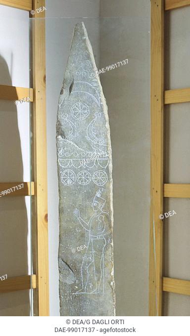 Votive stele with engraving depicting a priest carrying a child to be sacrificed (ritual of Molek). Artefact from tophet of Tanit and Baal Hammon in Carthage...