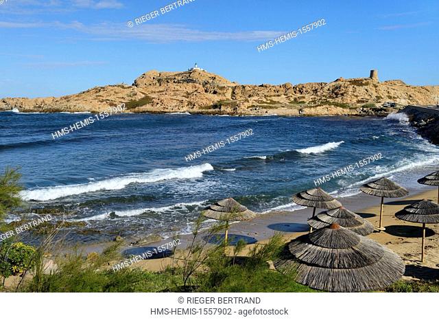 France, Haute Corse, Balagne, L'Ile Rousse, the Pietra Lighthouse and the 15th century Genoese tower behind the beach