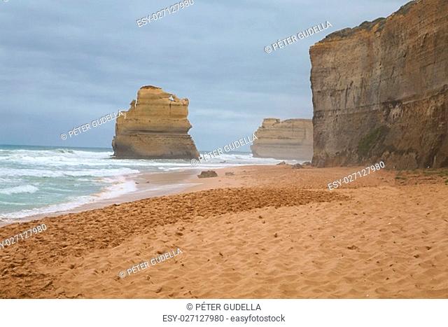 Sandy beach with big waves at the Twelve Apostles, Great Ocean Road, Australia