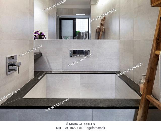 Large square bathtub in modern bathroom