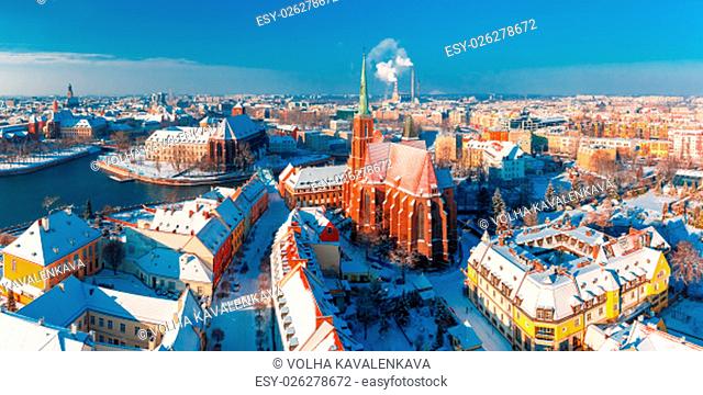 Aerial scenic panorama of Old Town and Ostrow Tumski with church of the Holy Cross and St. Bartholomew from Cathedral of St
