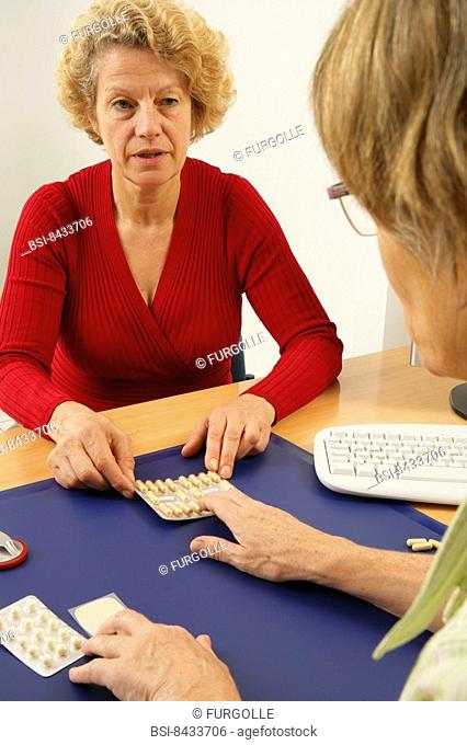 HORMONE REPLACEMENT THERAPY Models. The patient is showing the menopaused patient, different hormonal treatments of substitution :progesterone in capsules...