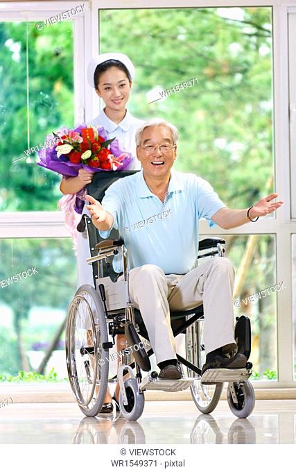 Mature man sitting in wheelchair