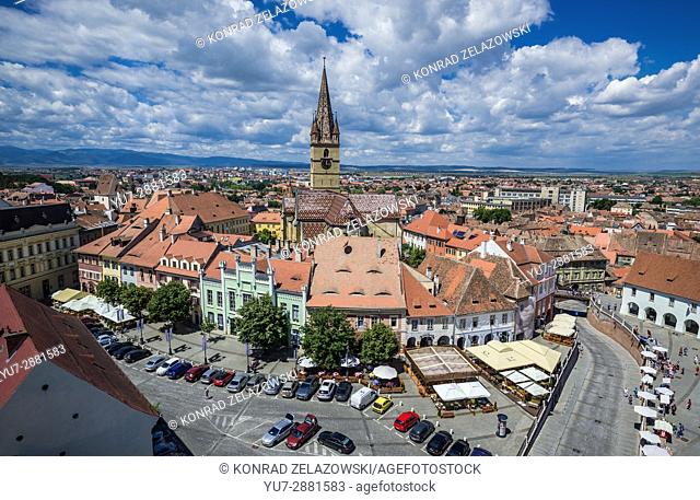 Aerial view from Council Tower with Hermes House (green building) and bell tower of Lutheran Saint Mary Cathedral, Historic Center of Sibiu, Romania