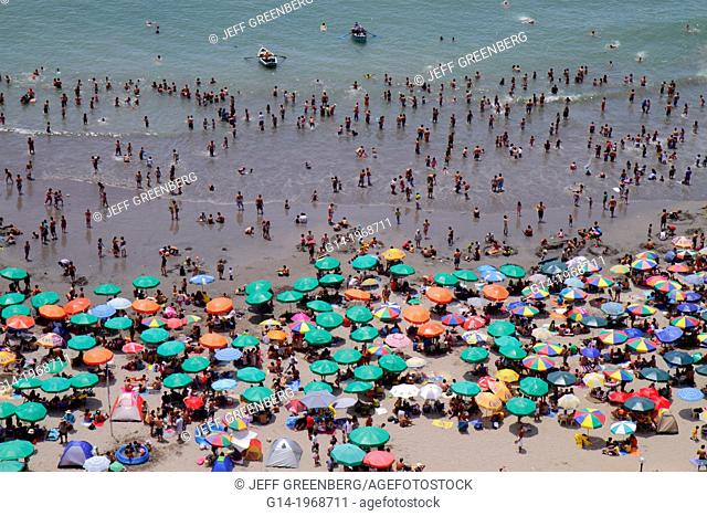 Peru, Lima, Barranco District, Malecon, Circuito de playas, Playa los Yuyos, Pacific Ocean, coast, aerial view, beach, crowd, crowded, umbrella, swimming