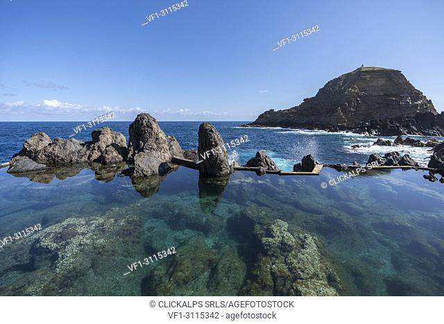 Natural pools with Mole islet in the background. Porto Moniz, Madeira region, Portugal