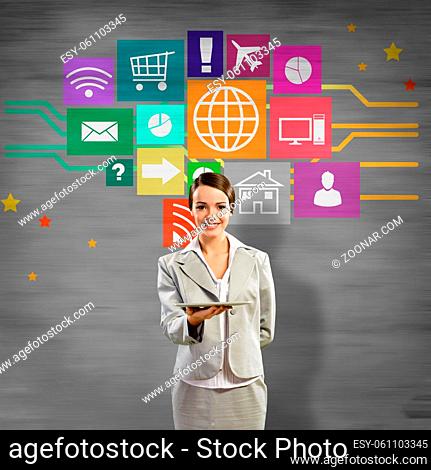 Businesswoman presenting tablet pc and color icons at background