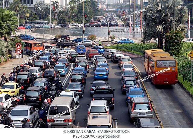 View from above with traffic jam on Jalan Sudirman at the intersection with BI Plaza Indonesia and a bus on a separated buslane, Jakarta, Java, Indonesia