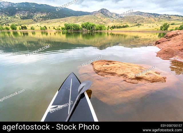 stand up paddleboard on a mountain lake - Horsetooth Reservoir in northern Colorado